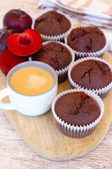 Chocolate muffins with plums