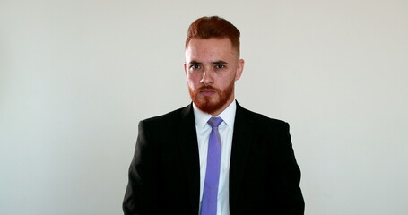Frustrated business man looking at camera shaking head, person covering face with hand in shame