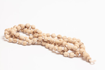 Rosary or prayer beads isolated on white background