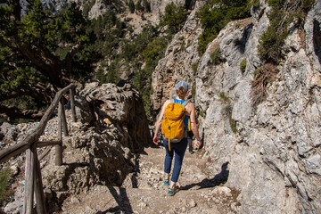 Young hiker in the steep Samaria Gorge on Crete