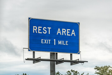 Blue color sign isolated closeup for rest area stop right exit in one mile in Sparks, south Georgia...