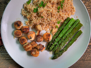 Top View of scallop dinner on natural wood surface