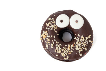 Tasty chocolate donut with eyes and nuts isolated on white background with soft shadow
