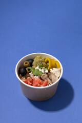 fast food vegetable soup on a blue background