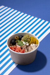 fast food vegetable soup on a blue background