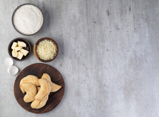 Chipas, typical south american cheese bun with ingredients and copy space