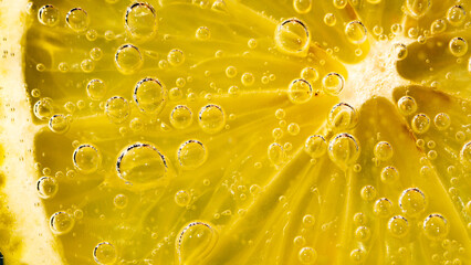  a lemon in soda with bubbles, summer fresh background