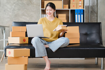 Successful online business owner happy and thrilled with laptop computer at office