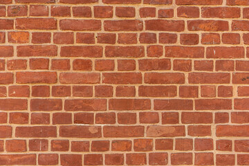 Empty brick red wall. background of a old brick house.