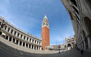 Fototapeta na wymiar Wide view of the Bell Tower of St. Mark in Venice Island in Italy in Southern Europe and blue sky