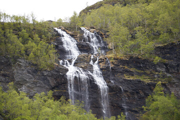 Falls in mountains of Norway in rainy weather.