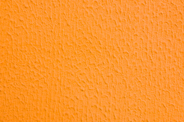 Abstract background of teracote plaster on the wall.