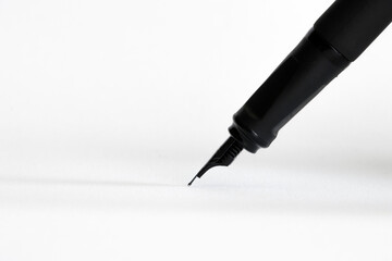 fountain pen writing on a blank white paper
