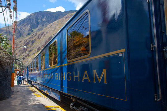 CUSCO, PERU - May 3, 2022: PeruRail train wagon on railway in peruvian forest landscape of scenic Altiplano mountain on way to latin tourist attraction Machu Picchu, Aguas Calientes