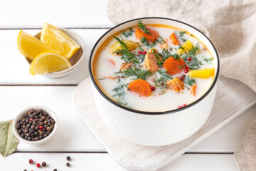 Lohikeitto, Finnish creamy salmon soup in a white bowl