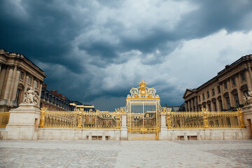 The Golden Gates of Versailles with Storm Clouds in the Background 