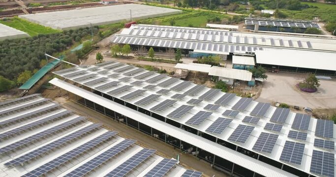 Aerial View of solar panels on the roofs of industrial buildings, Nir David, Northern District, Israel.