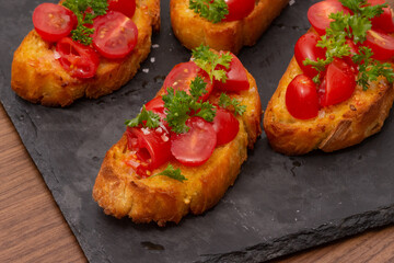 Bruschetta on a Charcoal Cutting Board