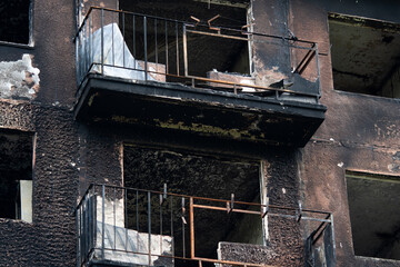 Windows of an apartment building after a fire.