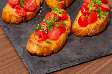 Bruschetta on a Charcoal Cutting Board
