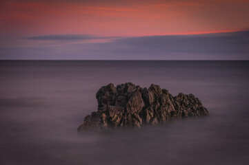 Sunrise on Reis Magos beach. Canico, Madeira, Portugal. October 2021. Long exposure picture