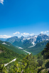 Fototapeta na wymiar Albanian Alps view. Accursed Mountains landscape viewed from Valbona and Theth hiking trail in Albania, popular hiking trail in the Albanian Alps.