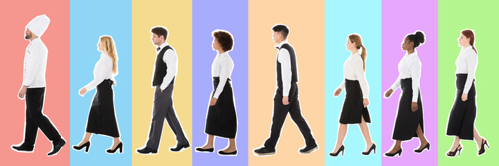 Young Restaurant Staff Walking In Row