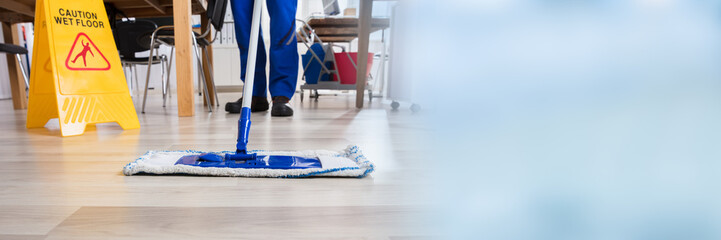 Janitor Cleaning Floor In Office
