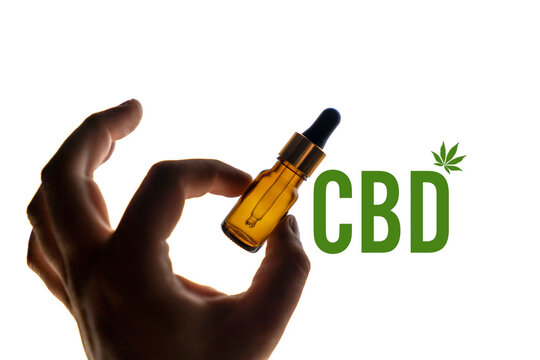 Bottle of CBD oil, medicinal marijuana on a white background