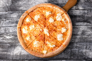 Pizza, hot pizza on a white wooden background, side and top view