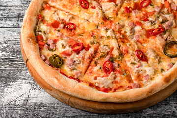 Pizza, hot pizza on a white wooden background, side and top view