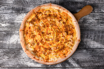 Italian pizza, hot pizza on a wooden white background