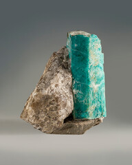 A rare gem nugget. Beryl (emerald) is a prismatic crystal in phlogopite mica. Expensive green crystal.