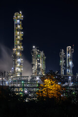night time silhouette of oil refinery PCK Schwedt producing fuel from russian oil pipe druschba