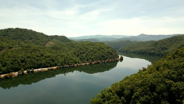Aerial video river reveal behind a mountain 4k