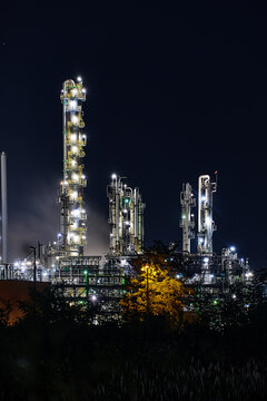 night time silhouette of oil refinery PCK Schwedt producing fuel from russian oil pipe druschba