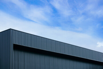Fototapeta na wymiar Metal sheet building modern with vivid sky