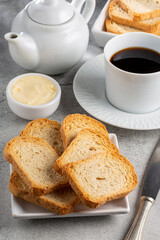 Healthy wholemeal toast with butter and coffee.