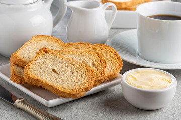 Healthy wholemeal toast with butter and coffee.