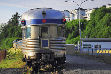 Passenger train stands by the platform. Prince George. - 514542926