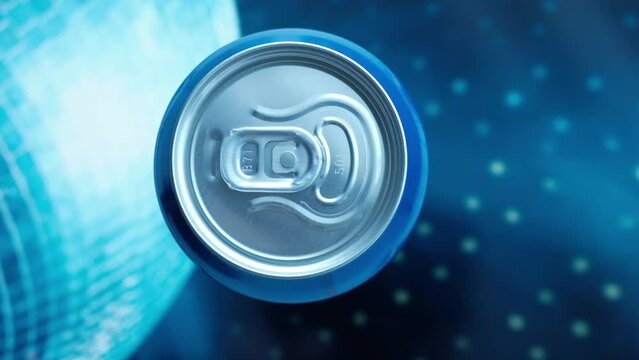 hand takes a metal can of a cool drink