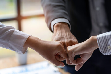 Businessman or partner in Asia team businessmen clenching fists After completing the agreement in...