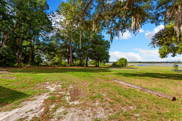 Large open field with a lake in the background