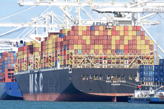 Oakland, CA - May 9, 2022: Cargo Ship MSC BEATRICE loading at the Port of Oakland, the fifth busiest port in the United States.