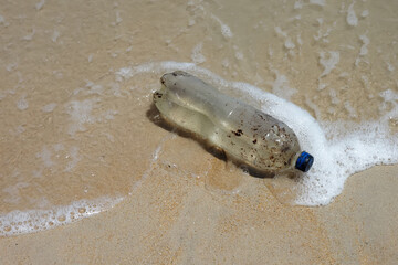 Old plastic bottles on the beach