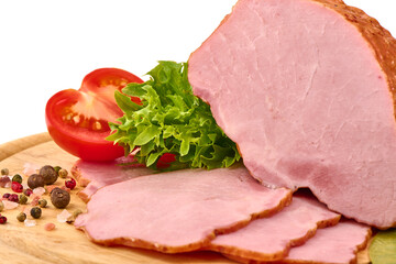 Smoked pork loin on a cutting board with condiments