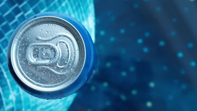 metal can with a drink on a blue background top view