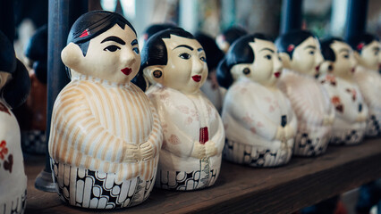 A couple of pottery miniatures with traditional clothes of Java, Indonesia