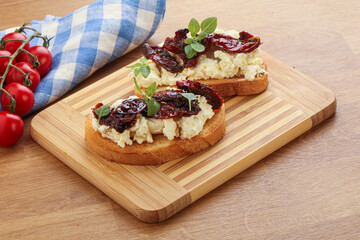 Bruschetta with soft cheese and tomato