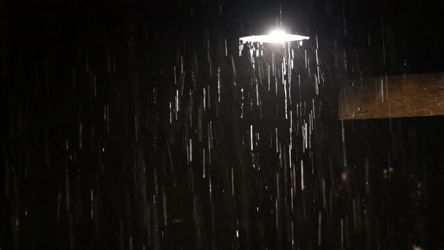 down light lamp enlightened in heavy rain at night 